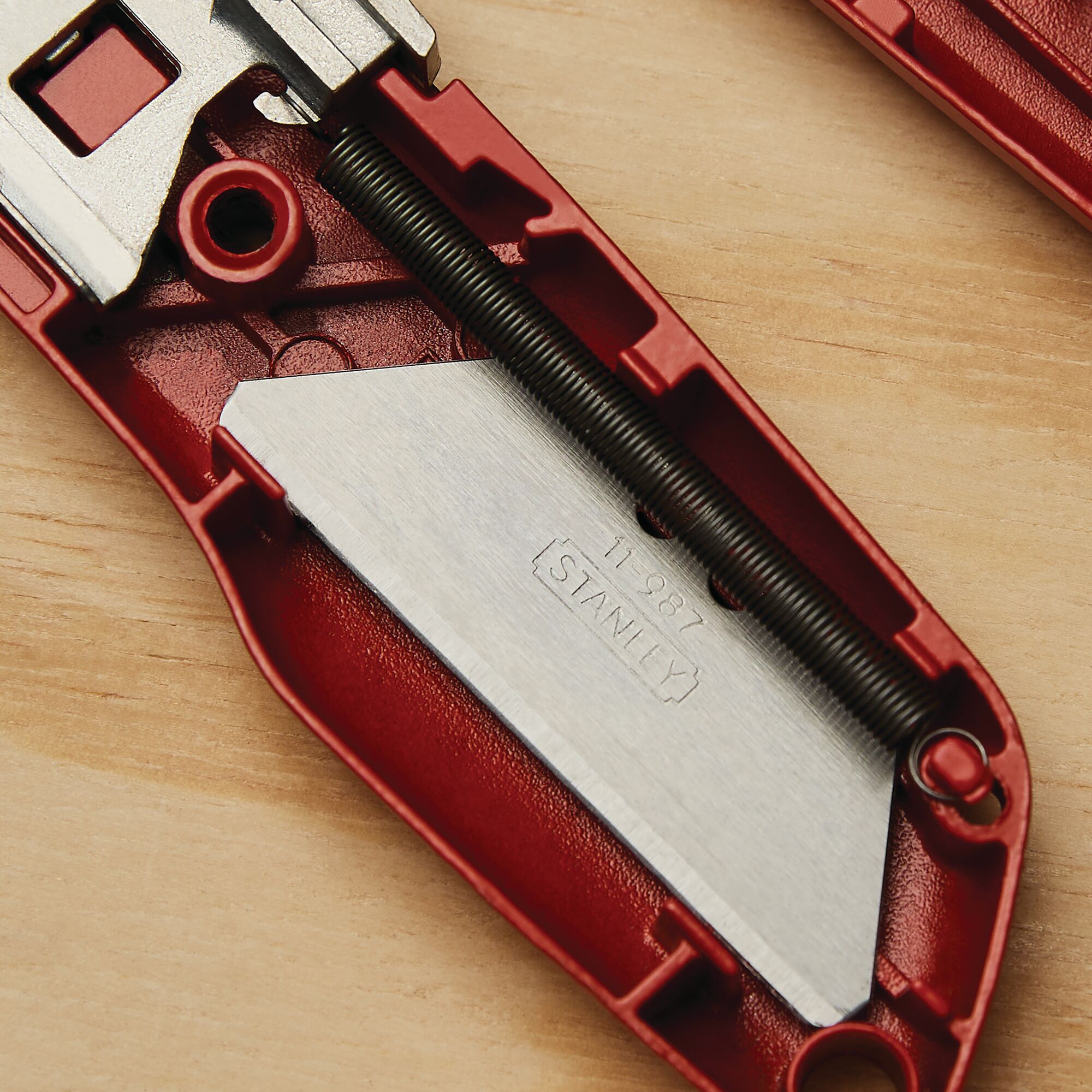 Photo of STANLEY 10-189C utility knife interior showing exposed blade and red housing.