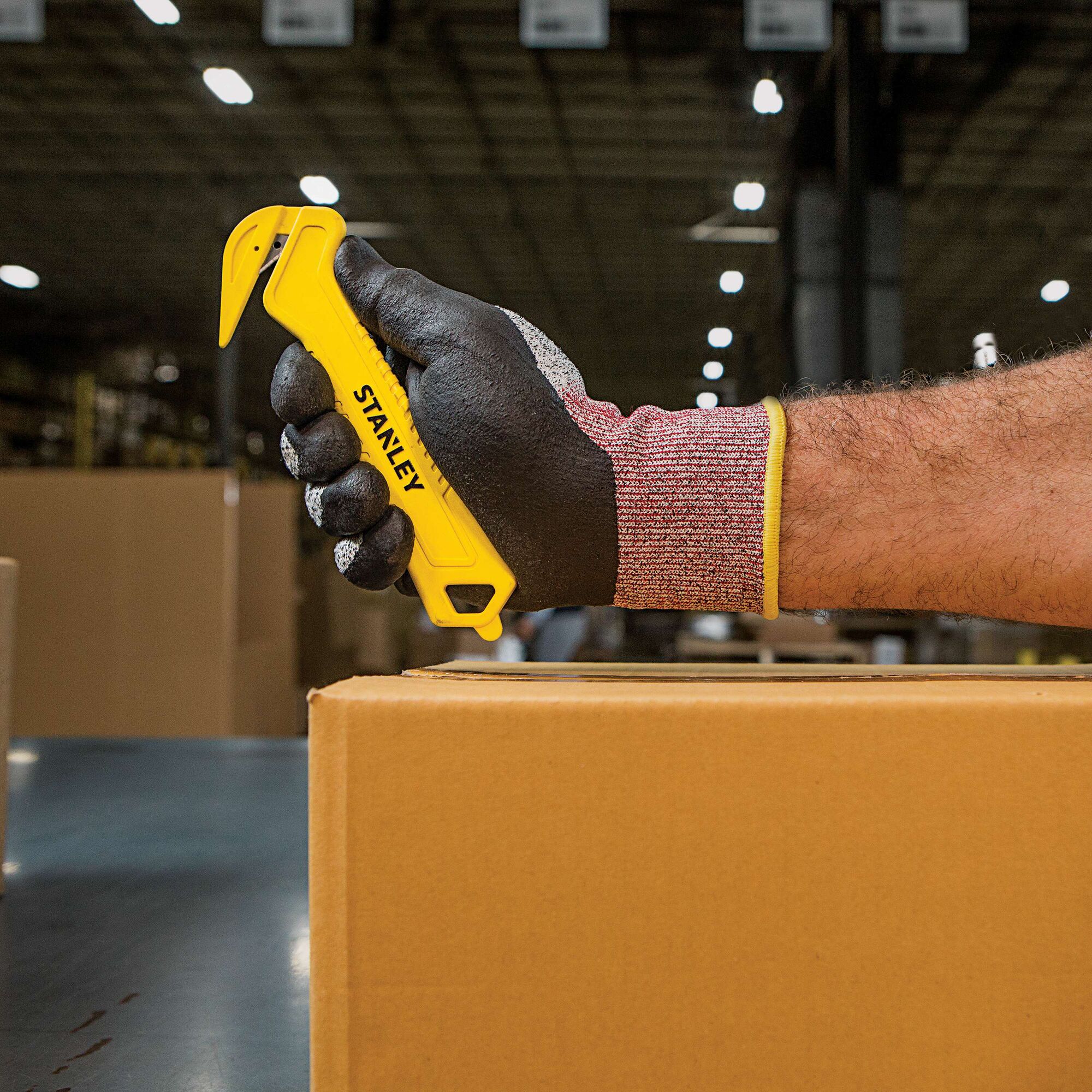 Single Sided Pull Cutter being held by person.