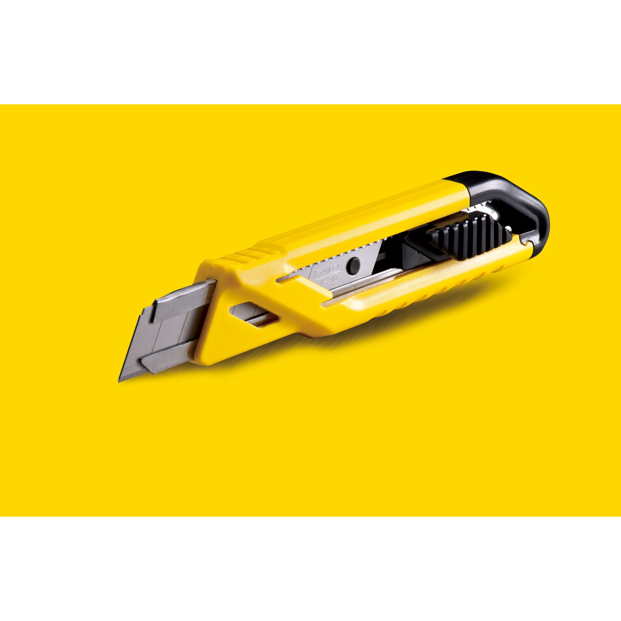 Photo of STANLEY STHT10265-8 yellow utility knife with black grip, angled on yellow background.