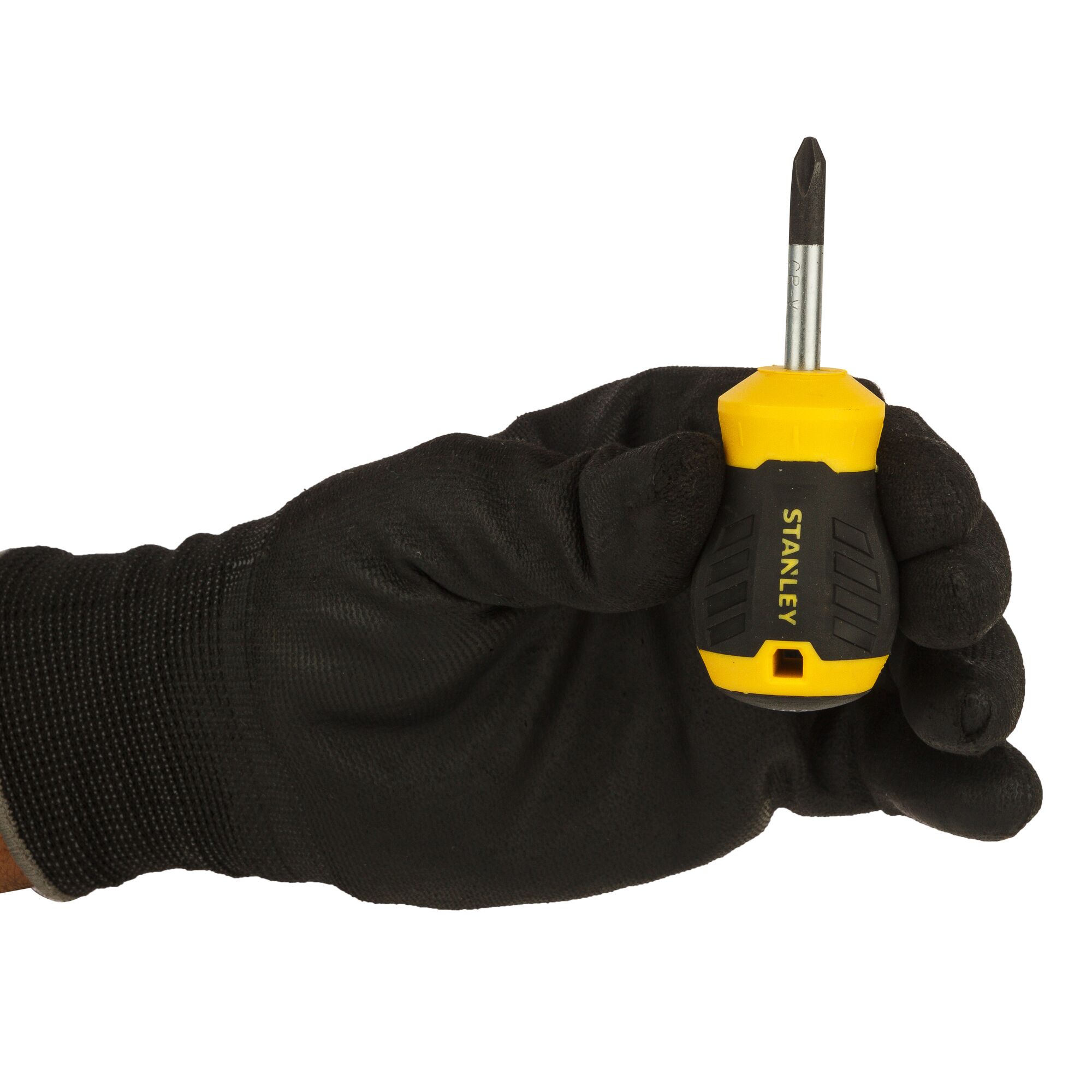 Stanley STMT60808-840 stubby screwdriver with yellow and black handle held in a gloved hand, side angle.
