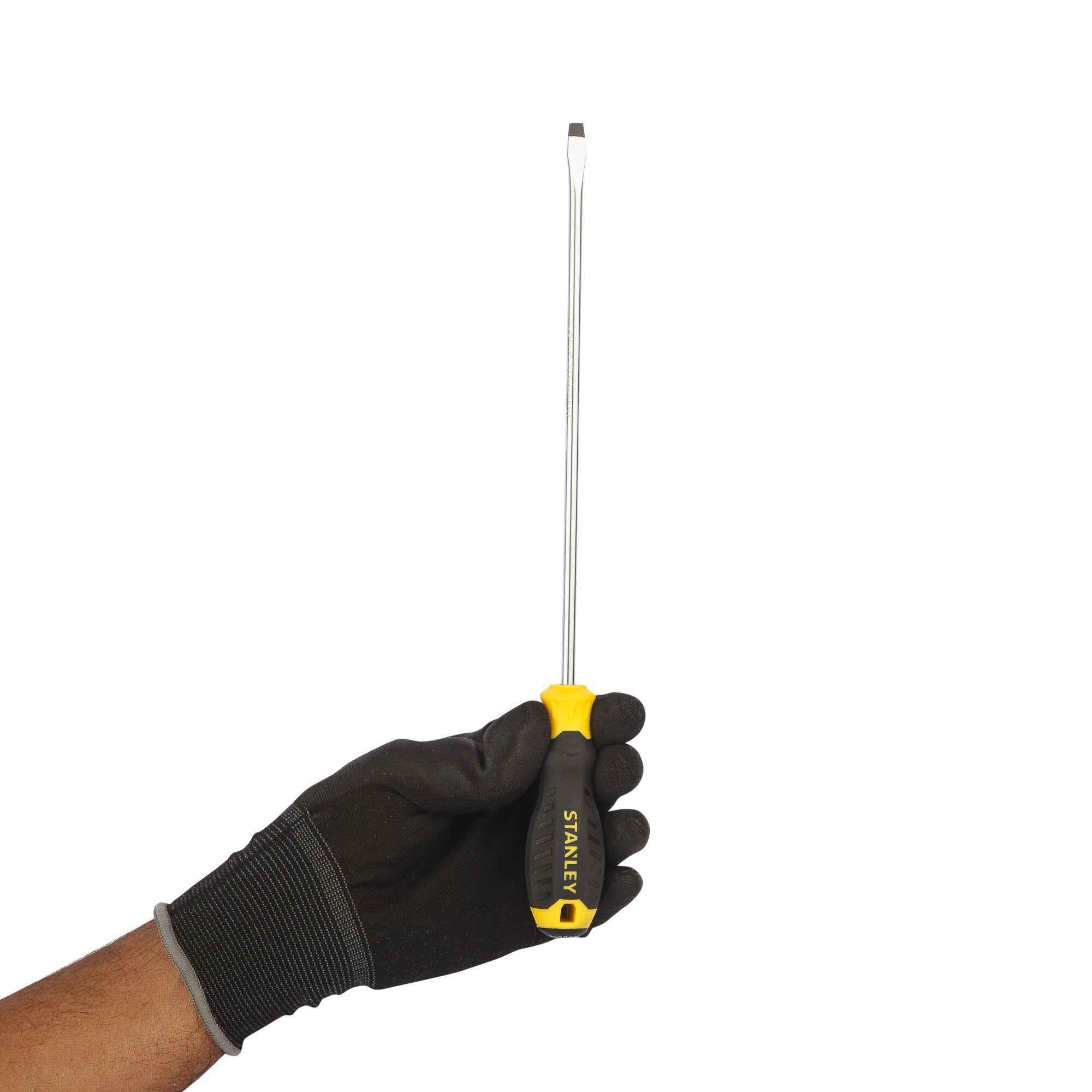 STANLEY STMT60824-8 long flathead screwdriver with black and yellow handle held by gloved hand, side view.
