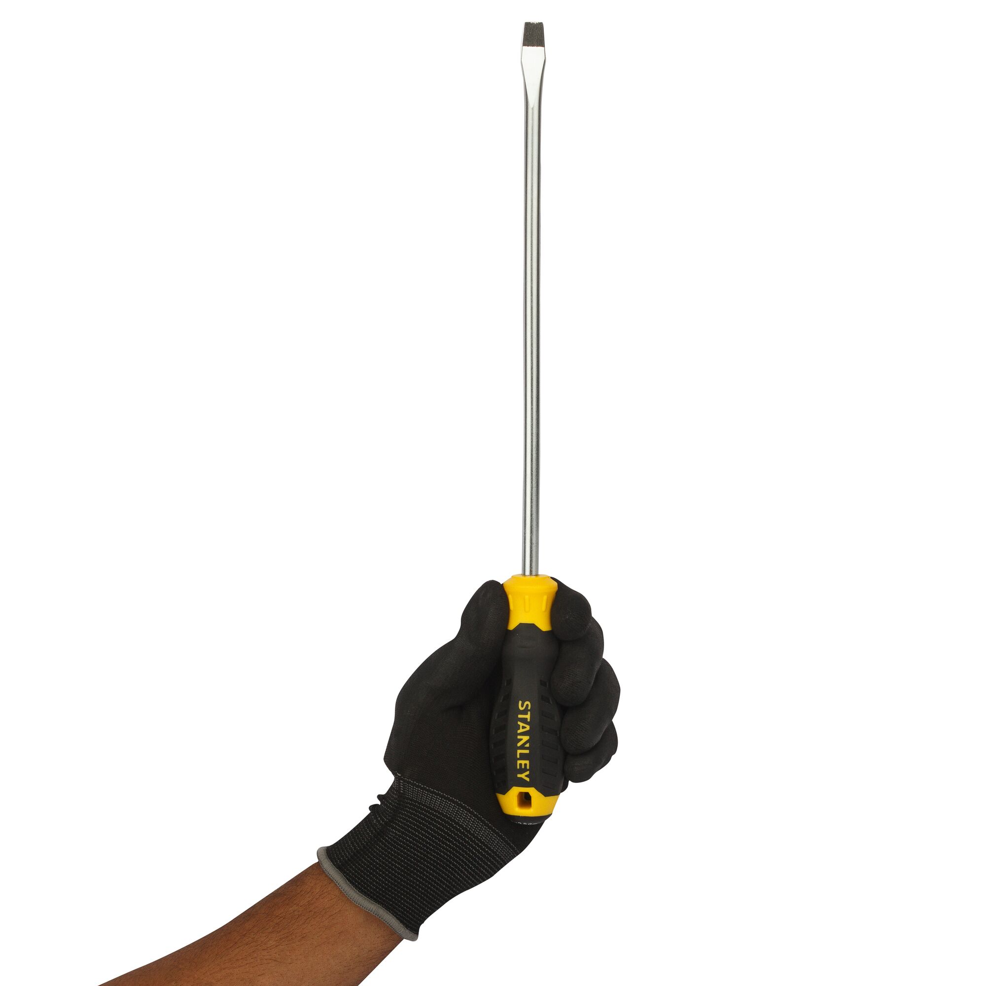 STANLEY STMT60833-8 flathead screwdriver with yellow and black handle held by gloved hand, side view.