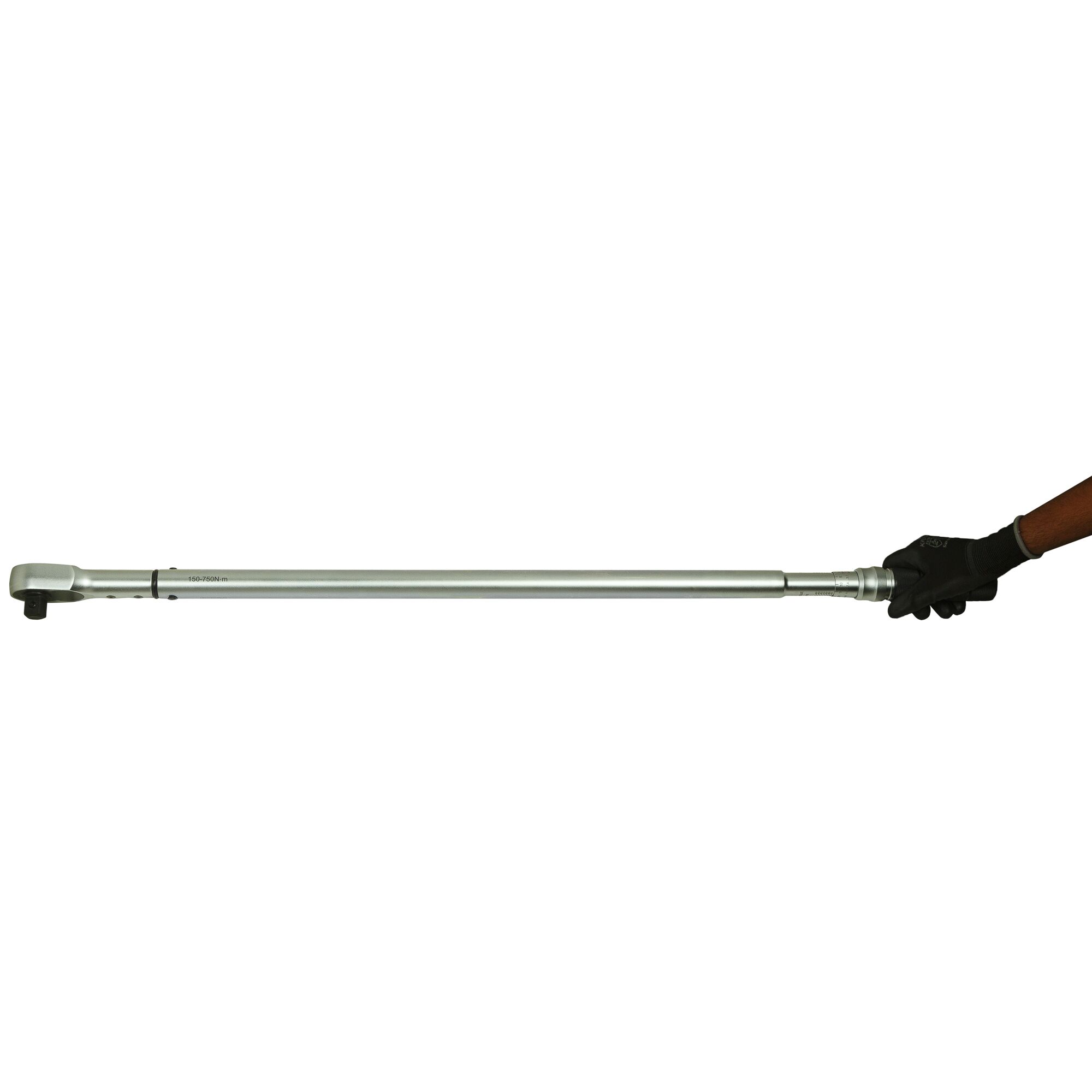 STANLEY STMT73592-8 torque wrench, long silver design, side view, held by a gloved hand.