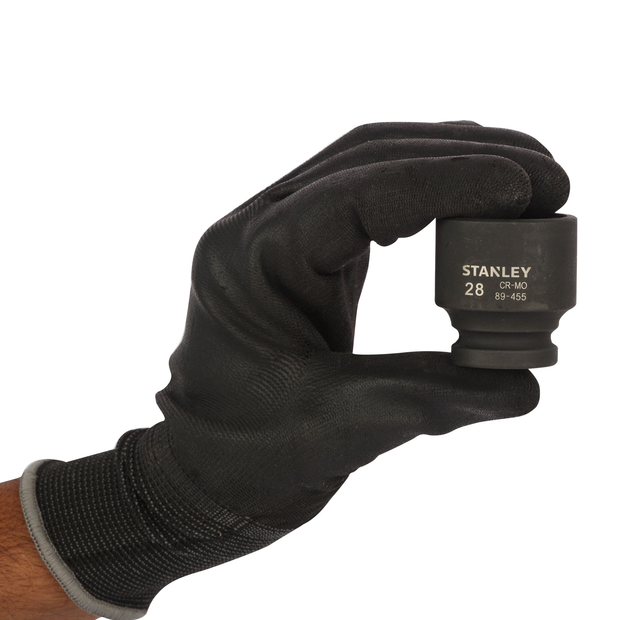 Photo of STANLEY STMT89455-8B 28mm socket held by gloved hand, product category photography, front angle.