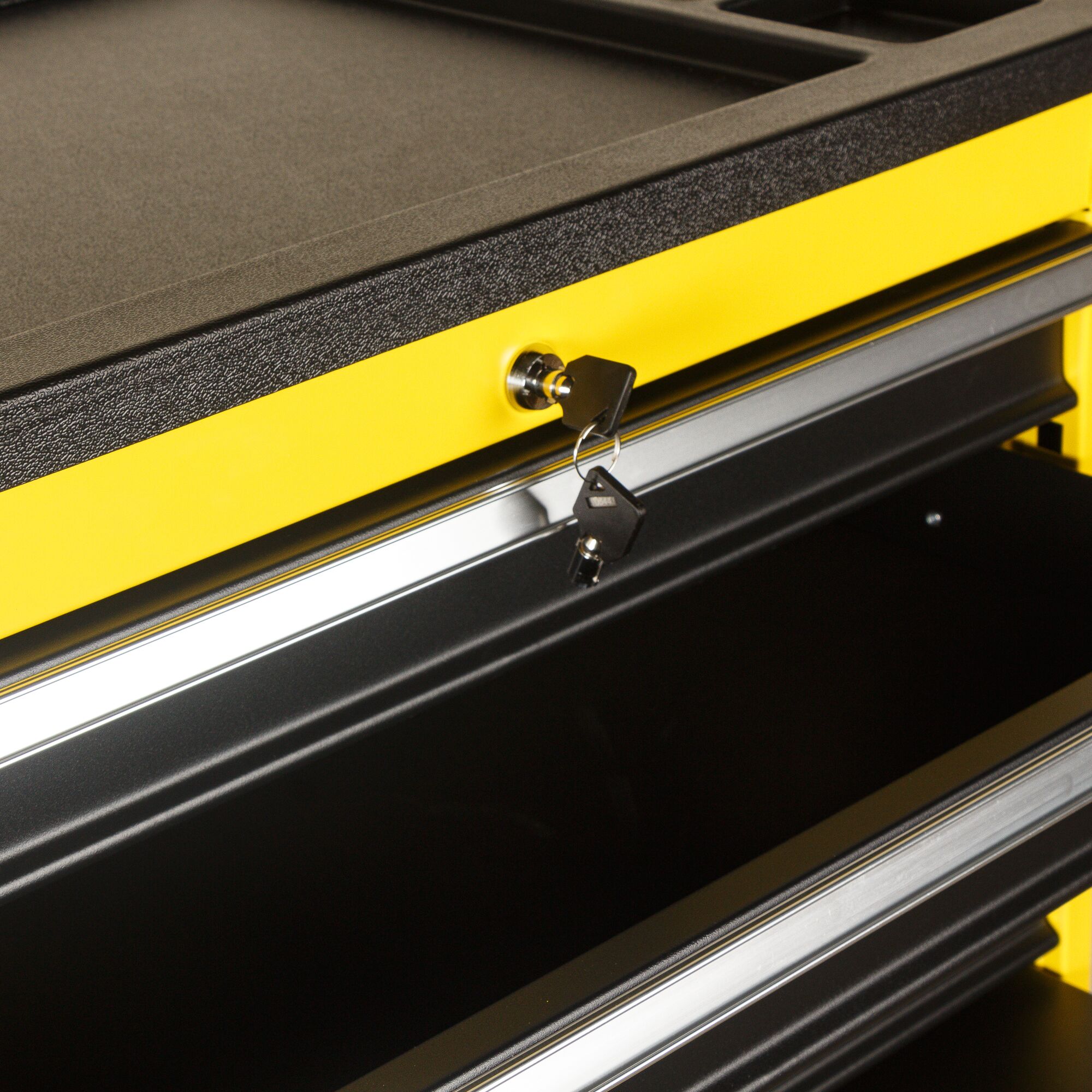 STANLEY STMT99069-8 yellow tool chest with open drawer and keys in lock, angled view.