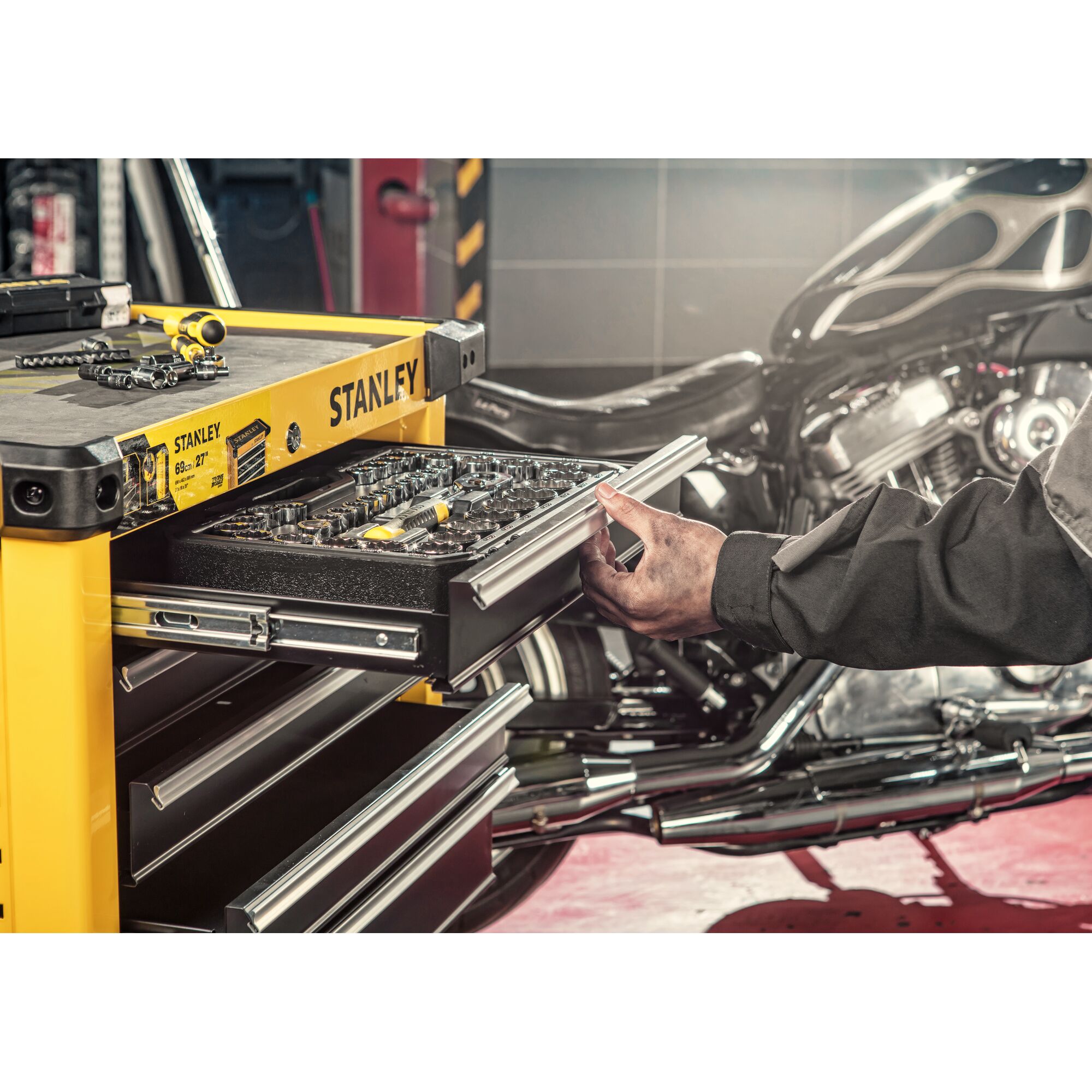 STANLEY STST74306-8 yellow tool chest photography with open drawer showing tools, angled workshop view.